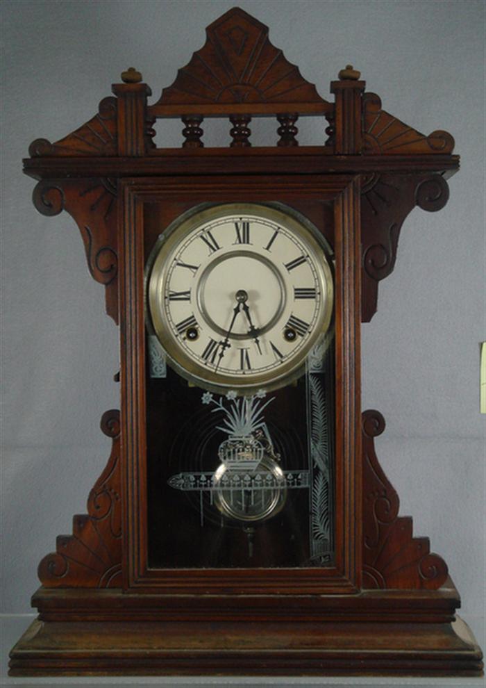 Appraisal: Walnut Waterbury mantle clock spindled crest day runs strikes k