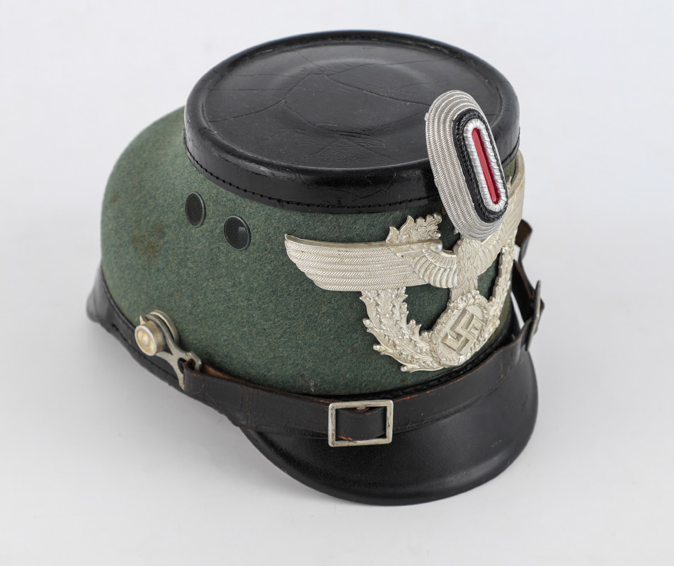 Appraisal: WWII GERMAN POLICE SHAKO HELMET Enlisted men's shako with green