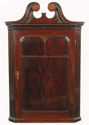 Appraisal: A George III mahogany hanging corner cupboard the swan neck