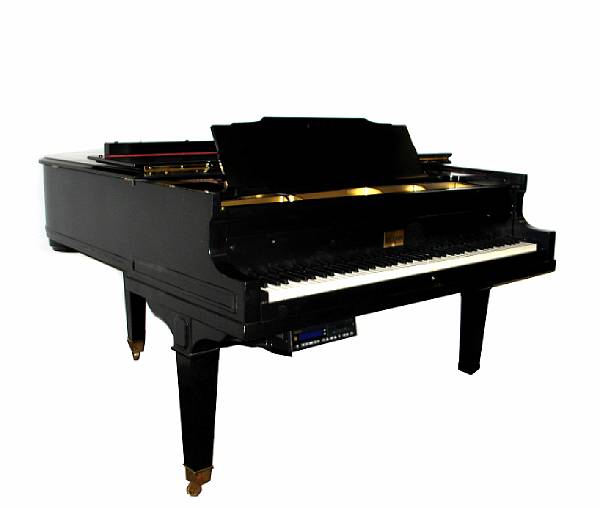 Appraisal: A Baldwin baby grand piano with later piano disk player