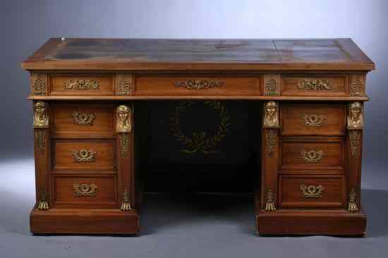 Appraisal: FRENCH EMPIRE STYLE MAHOGANY AND GILT-BRONZE MOUNTED KNEEHOLE DESK circa