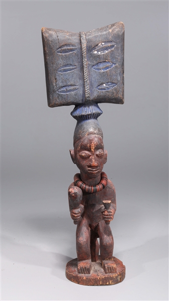 Appraisal: Carved wood African musician figure with beaded necklace early th