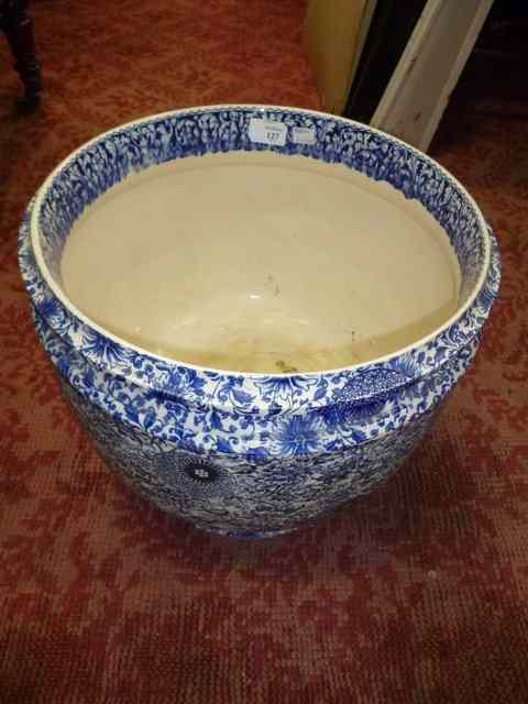 Appraisal: A DOULTON BLUE AND WHITE POTTERY JARDINIERE standing on a