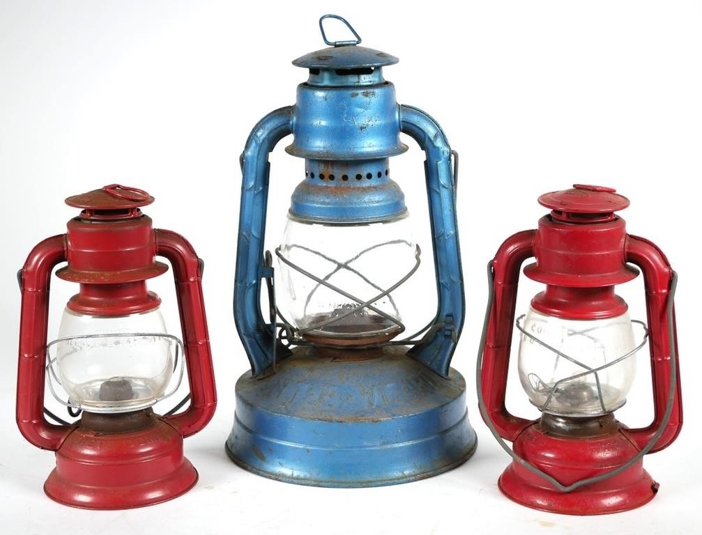 Appraisal: THREE VINTAGE DIETZ RAILROAD LANTERNSThree railroad lanterns two are red