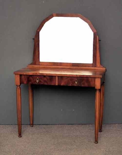 Appraisal: A mahogany dressing table in the Art Deco manner with