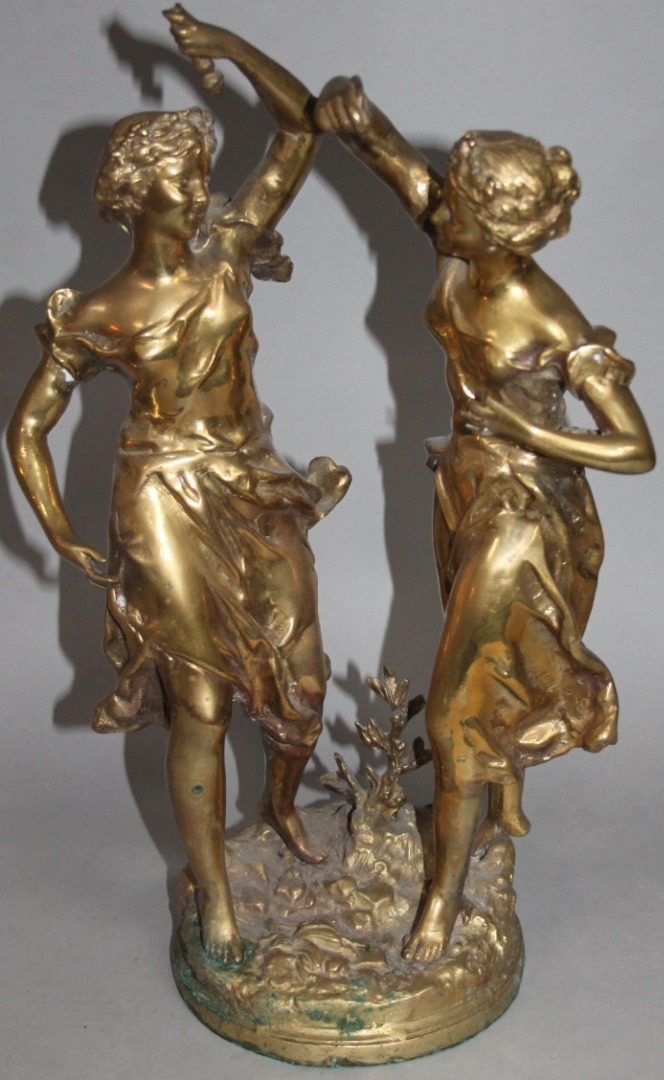 Appraisal: An early thC brass sculpture of two ladies in a