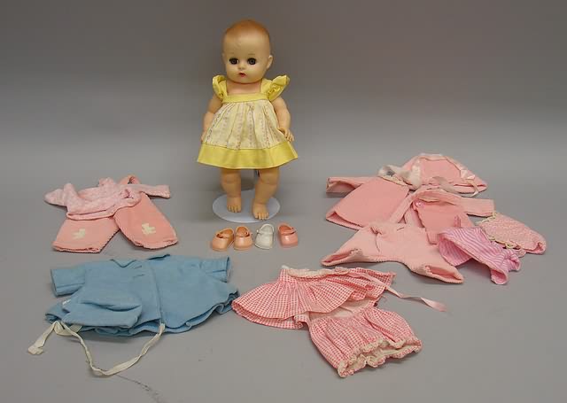 Appraisal: Vogue Ginnette lot Vinyl Ginnette baby doll with Ginnette outfits