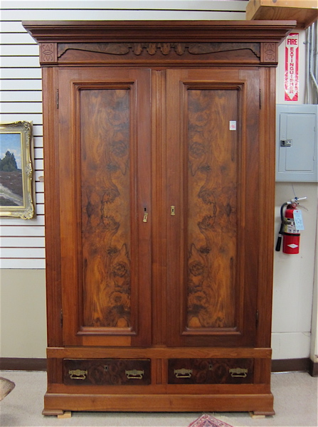 Appraisal: VICTORIAN WALNUT AND BURL WALNUT WARDROBE American c having a