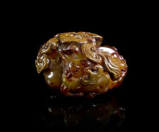 Appraisal: A Chinese Carved Agate Toggle of a mottled brown and