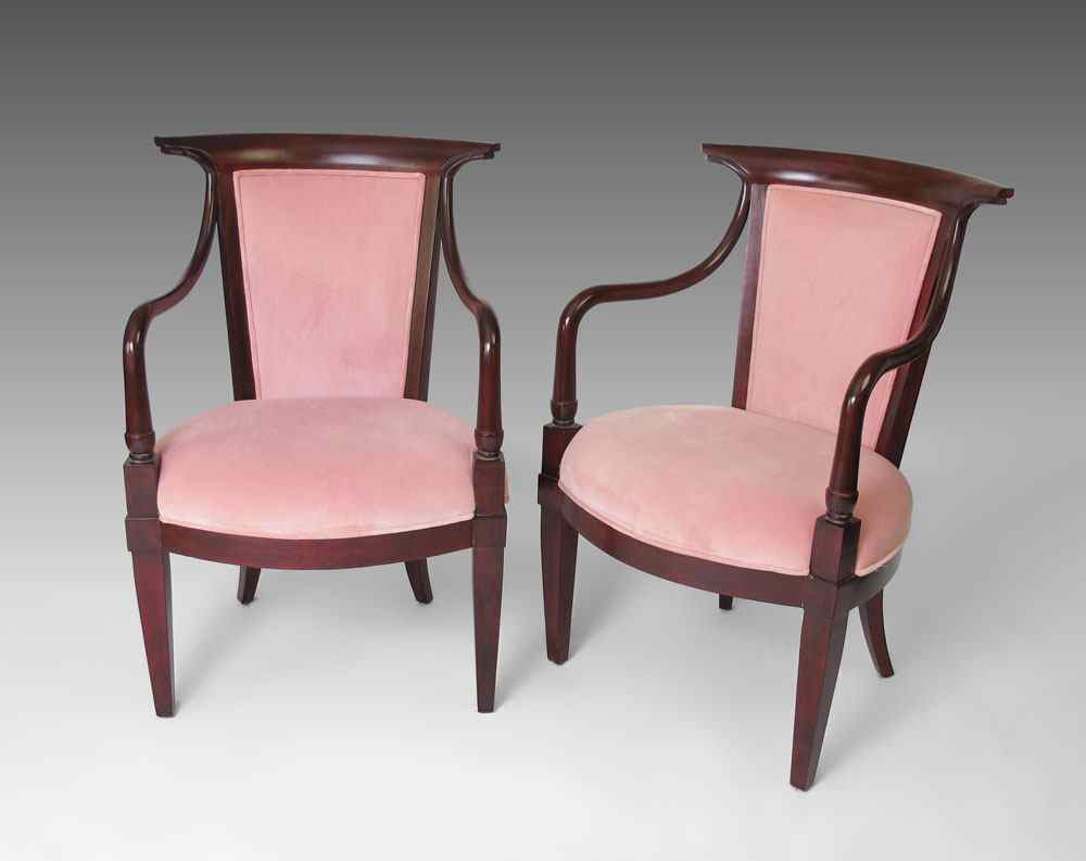 Appraisal: PAIR MAHOGANY FRAMED PARLOR CHAIRS Gently curved open arms pink