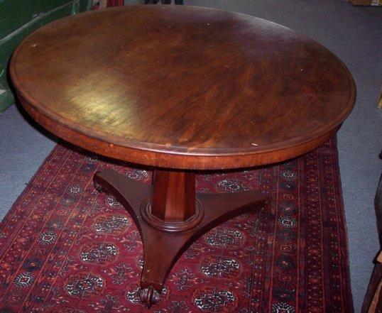 Appraisal: A Victorian circular mahogany dining table raised on a octagonal