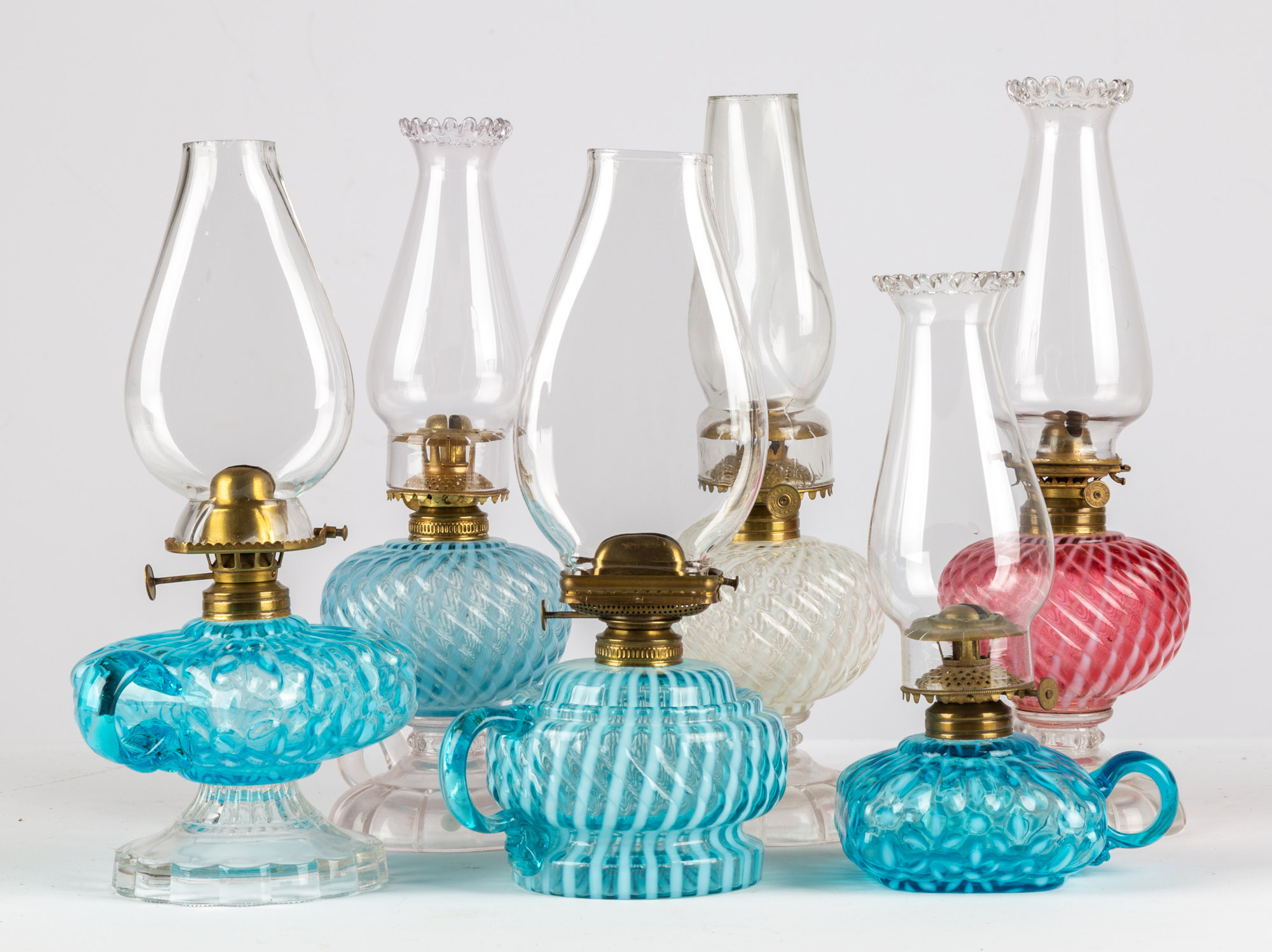 Appraisal: OPALESCENT GLASS FINGER OIL LAMPS circa