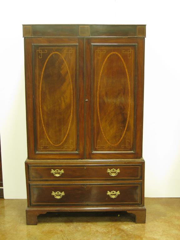 Appraisal: A th Century mahogany Wardrobe with pair of panelled doors