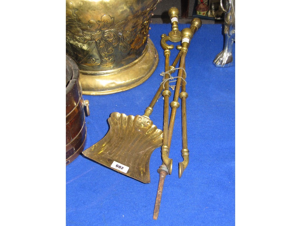 Appraisal: Set of brass fire implements