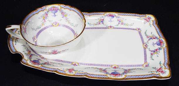 Appraisal: Royal Worcester bone china cup and sandwich plate hand coloured