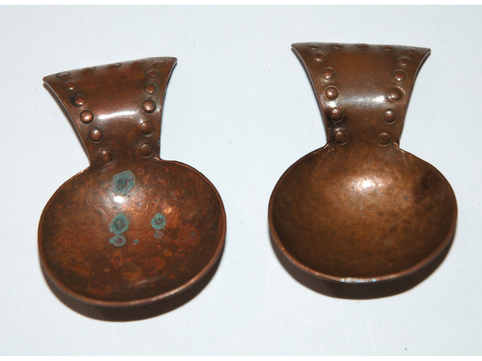 Appraisal: A lot comprising two Arts and Crafts hammered copper caddy