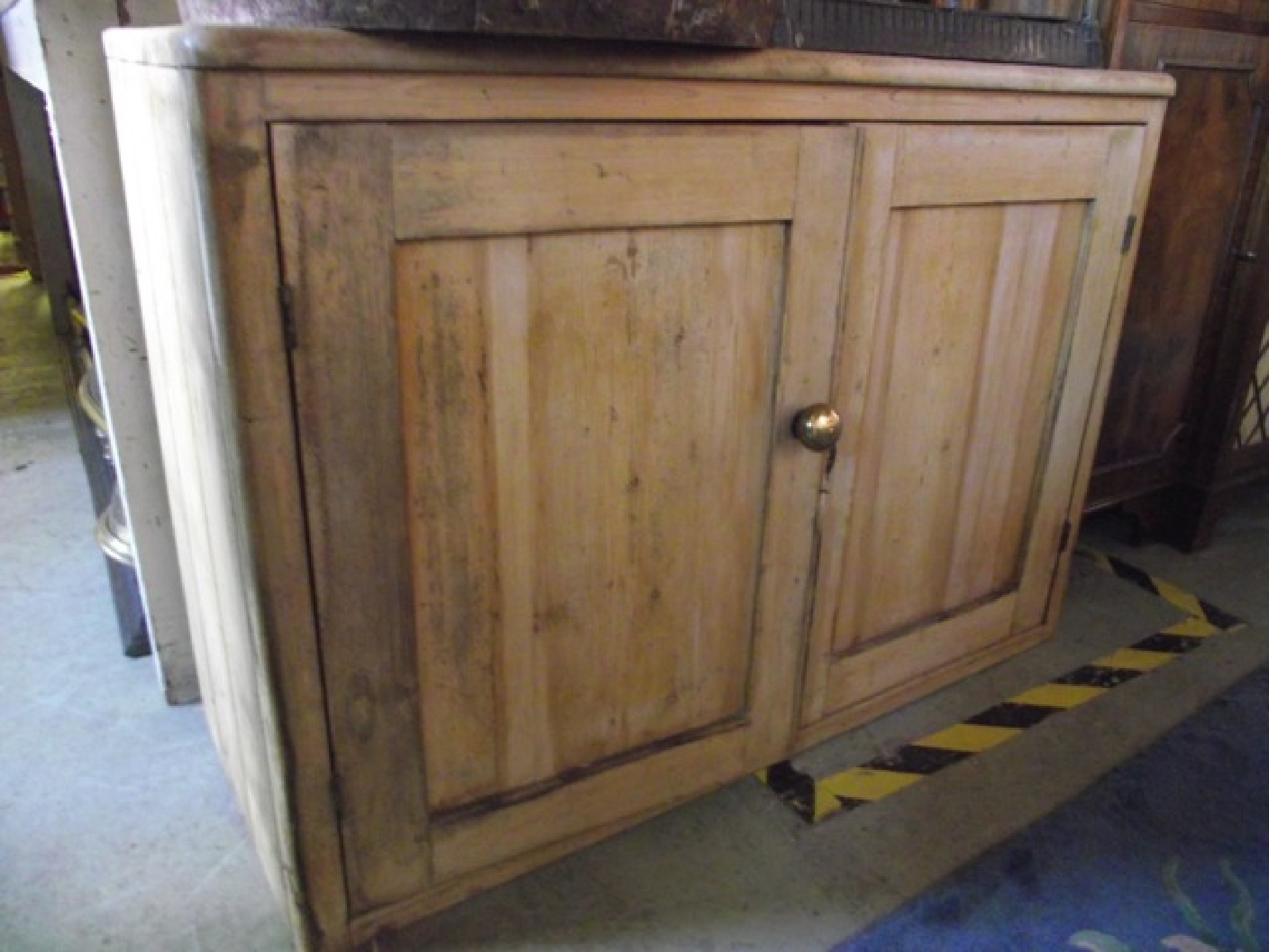 Appraisal: A low vintage stripped pine side cupboard enclosed by a