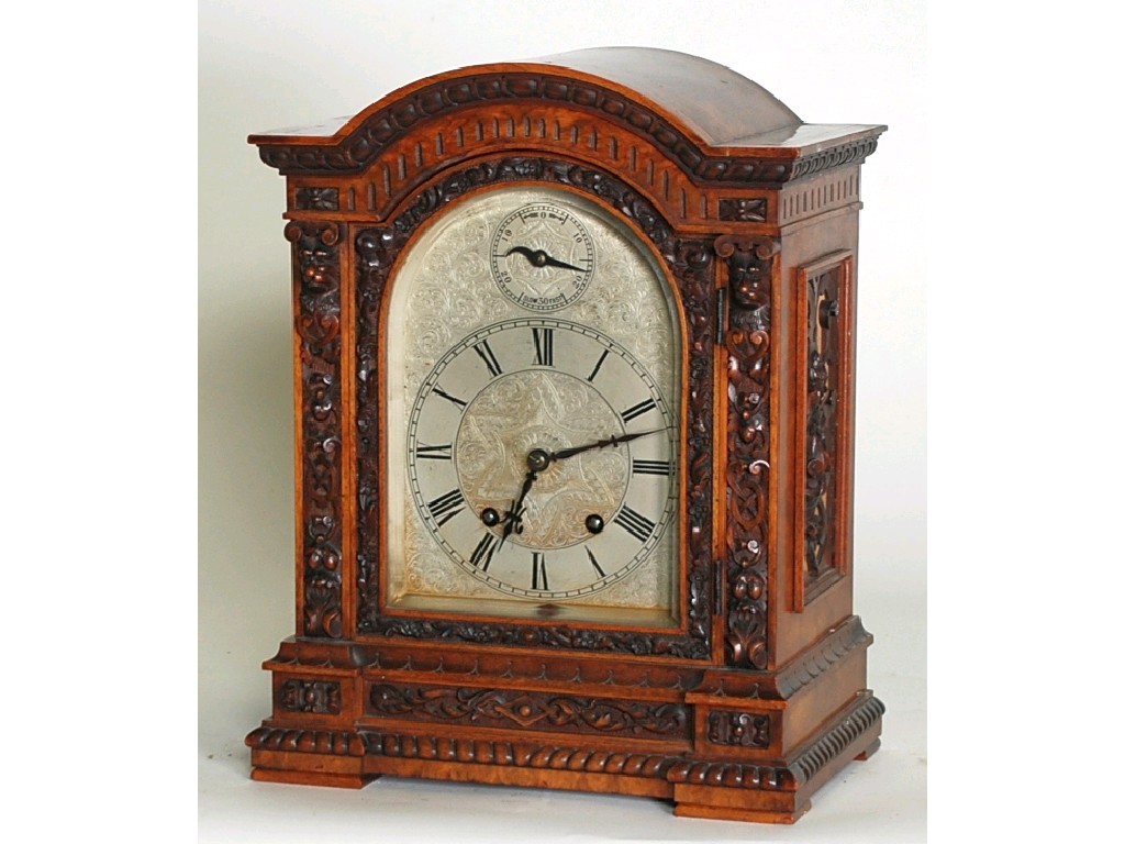 Appraisal: LATE NINETEENTH CENTURY CARVED WALNUTWOOD LENZKIRCH ' MILLION' MANTEL CLOCK