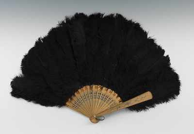 Appraisal: A Black Ostrich Feather Hand Fan With carved and pierced