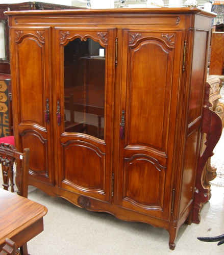 Appraisal: PROVINCIAL STYLE MAHOGANY CABINET BOOKCASE French th century having three