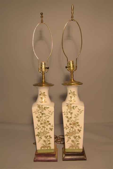 Appraisal: PAIR OF GREEN AND WHITE FLORAL CERAMIC LAMPS of tapering