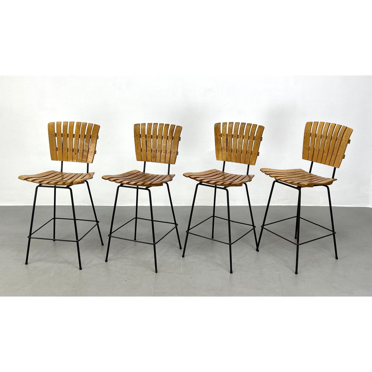 Appraisal: Set Arthur Umanoff Bar Stools with Iron Bases Slat design