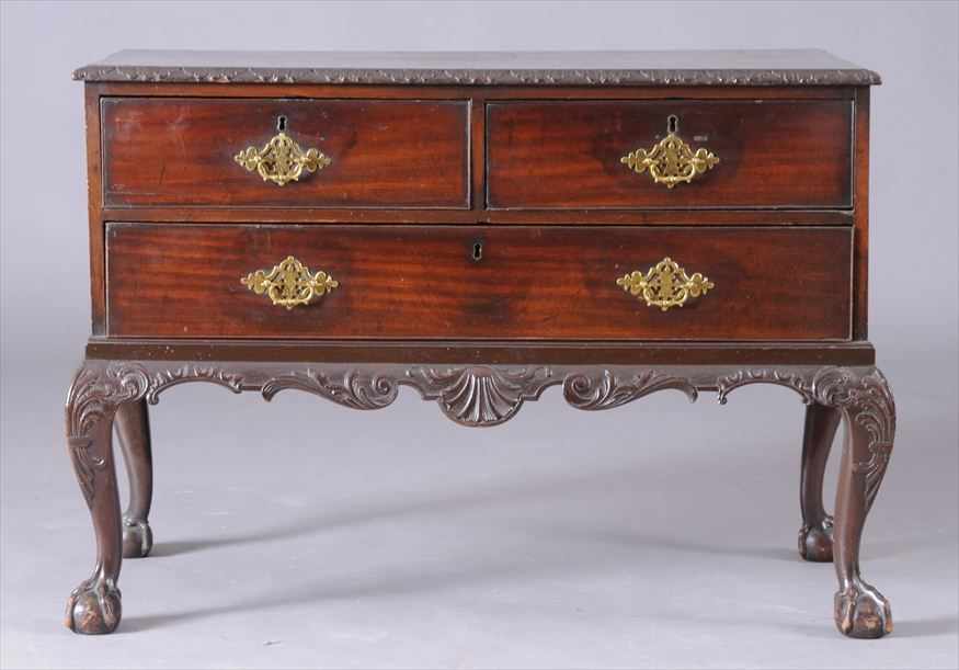 Appraisal: GEORGE III MAHOGANY COMMODE The top with foliate edge above