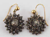 Appraisal: A pair of silver rose cut diamond earrings with yellow