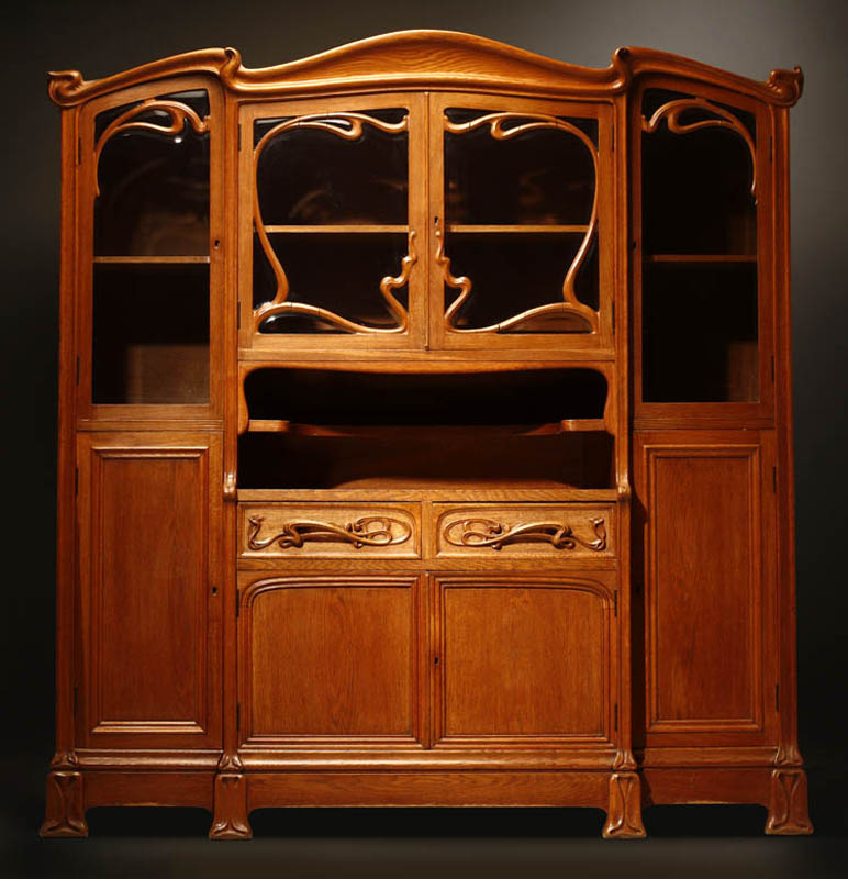 Appraisal: An Italian Art Nouveau oak buffet An Italian Art Nouveau