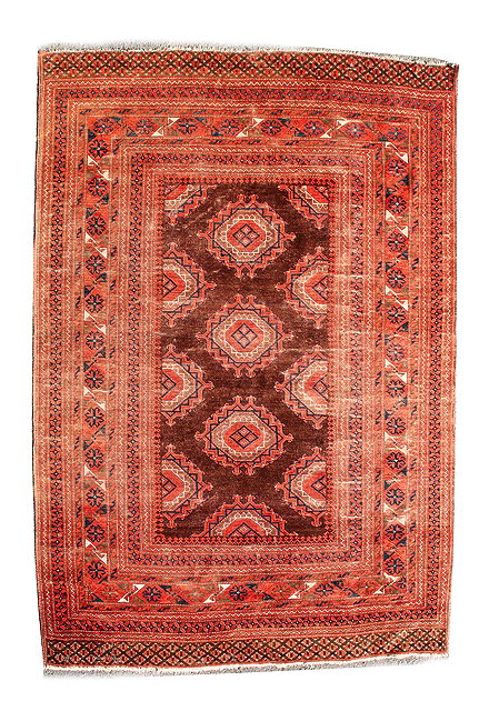 Appraisal: AN ANTIQUE BACARA RED GROUND RUG with three central Russian