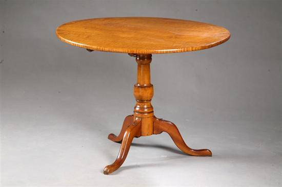 Appraisal: TILT-TOP TEA TABLE American th century curly maple and cherry