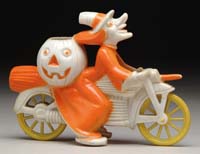 Appraisal: RARE COLOR ORANGE AND WHITE WITCH ON MOTORCYCLE Plastic white