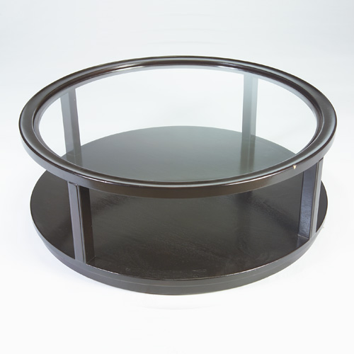 Appraisal: DUNBAR Circular coffee table with inset glass top and lower