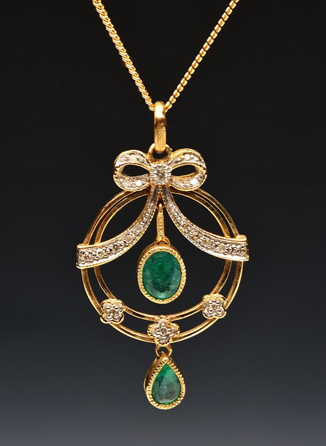 Appraisal: AN CT GOLD PENDANT with stylised emerald and diamond setting