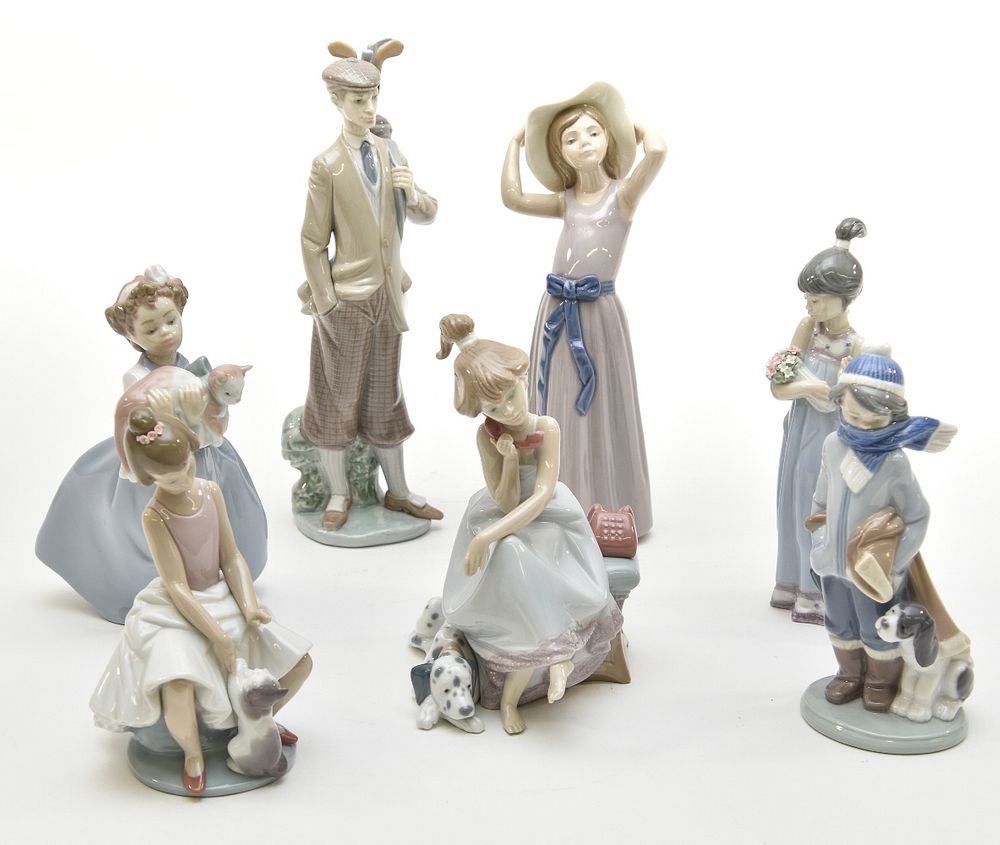 Appraisal: Seven Lladro Figurines Seven Lladro figures including a golfer h