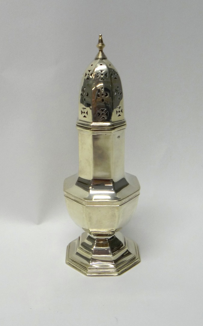 Appraisal: A silver sugar caster of octagonal baluster form raised on