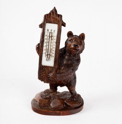 Appraisal: A Black Forest carved thermometer stand of bear form modelled