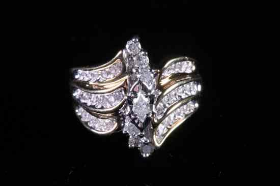 Appraisal: YELLOW GOLD AND DIAMOND COCKTAIL RING Marquise diamond raised and