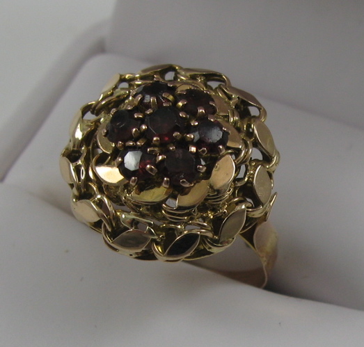 Appraisal: TWO GARNET AND FOURTEEN KARAT GOLD RINGS One set with