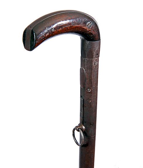 Appraisal: Under hammer Percussion Gun Cane Ca - An iron and