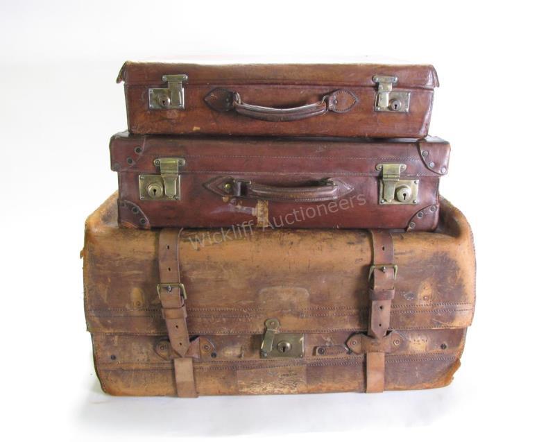 Appraisal: A group of three pieces of antique leather luggage formerly