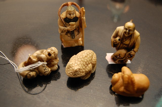 Appraisal: A COLLECTION OF JAPANESE IVORY AND BONE NETSUKE Comprising four