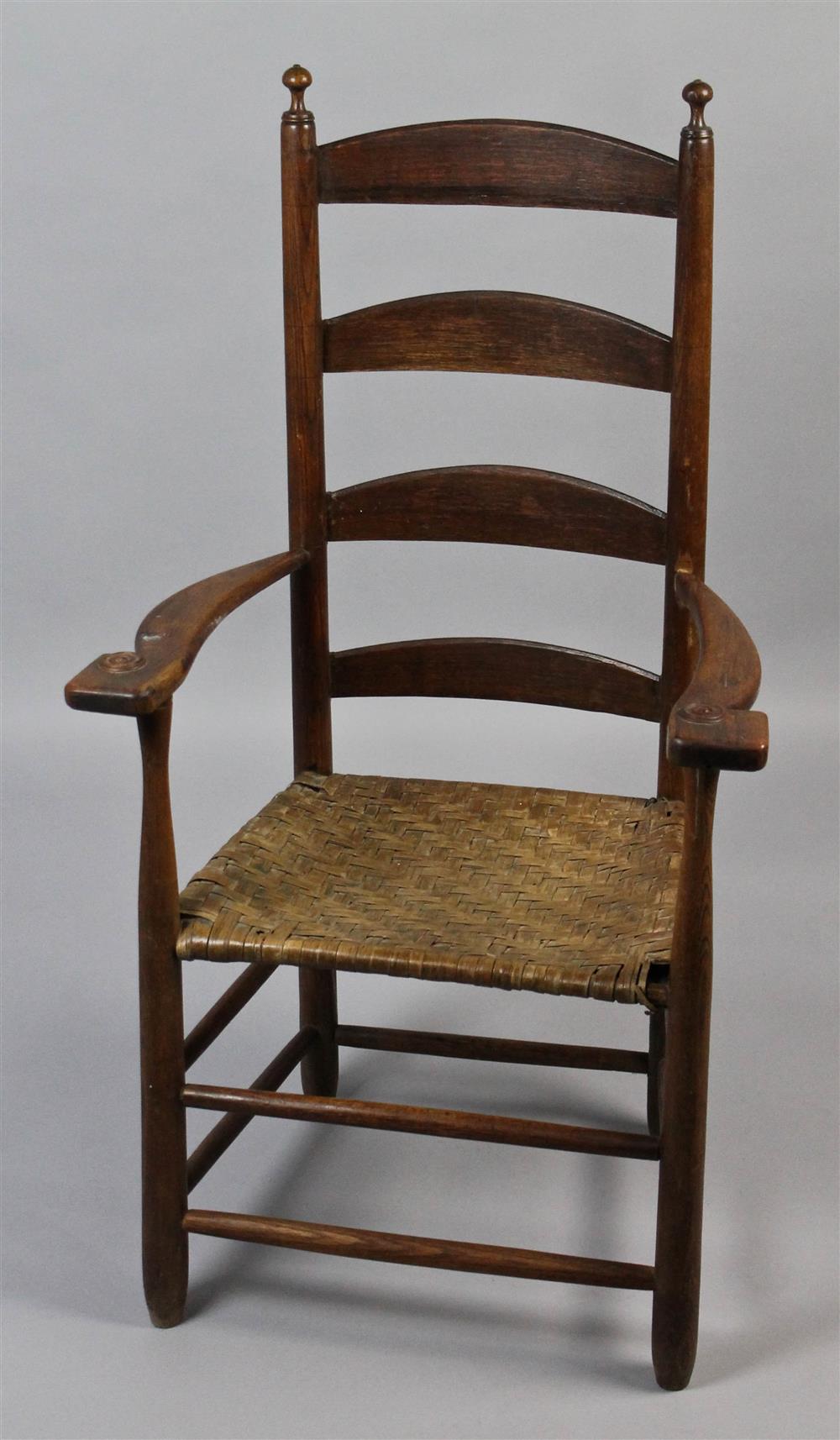 Appraisal: SOUTHERN LADDERBACK ARM CHAIR curved splats flanked by turned stiles