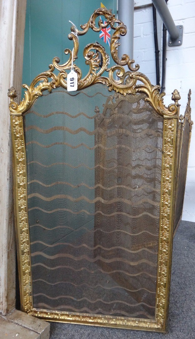 Appraisal: A French gilt brass and mesh four panel fire screen