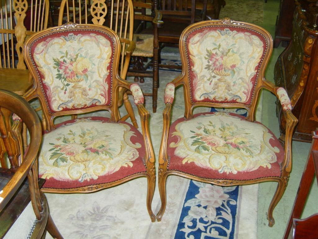 Appraisal: A pair of French beech wood salon chairs with needlework