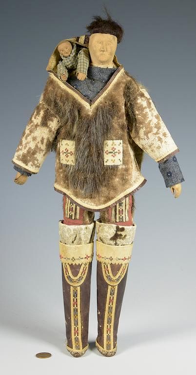 Appraisal: Eskimo Doll with Papoose Elaborate Clothing Eskimo Wooden doll carved