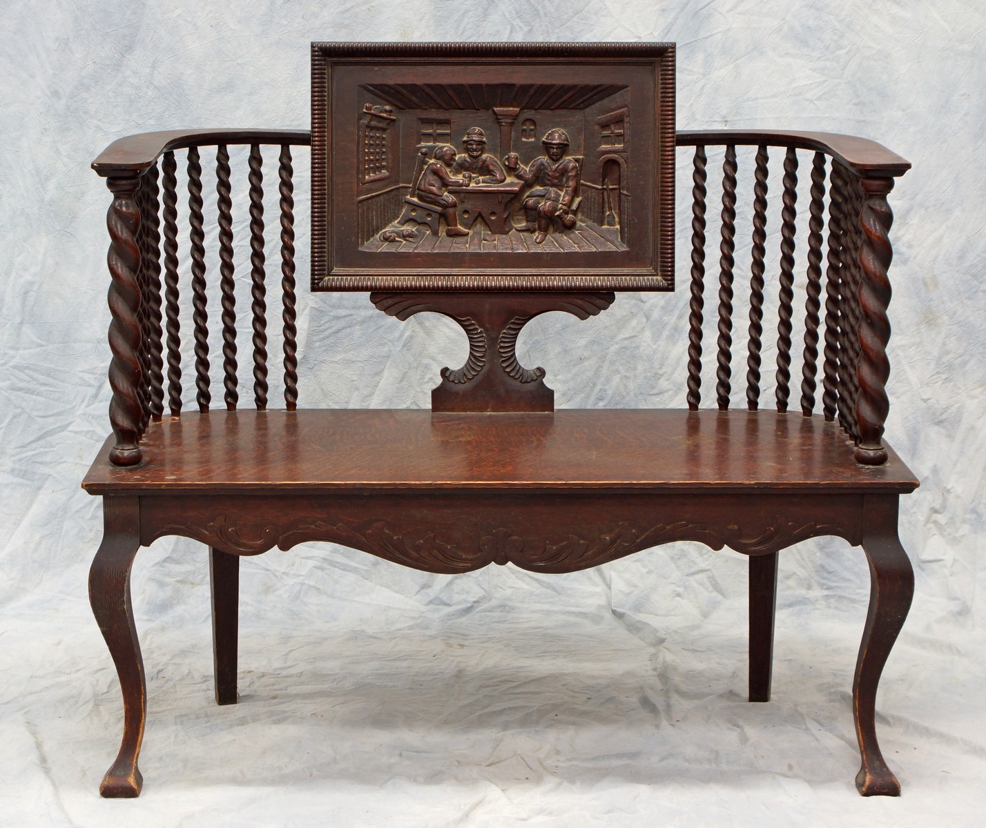 Appraisal: Carved Oak Hall Bench with central carved pub scene and