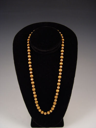 Appraisal: K YELLOW GOLD BEAD NECKLACE Bright and brushed finish beads