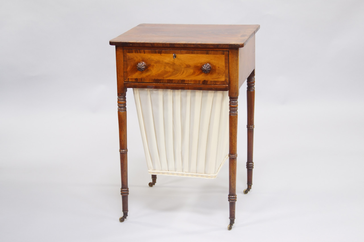 Appraisal: A George IV mahogany and rosewood crossbanded sewing table single