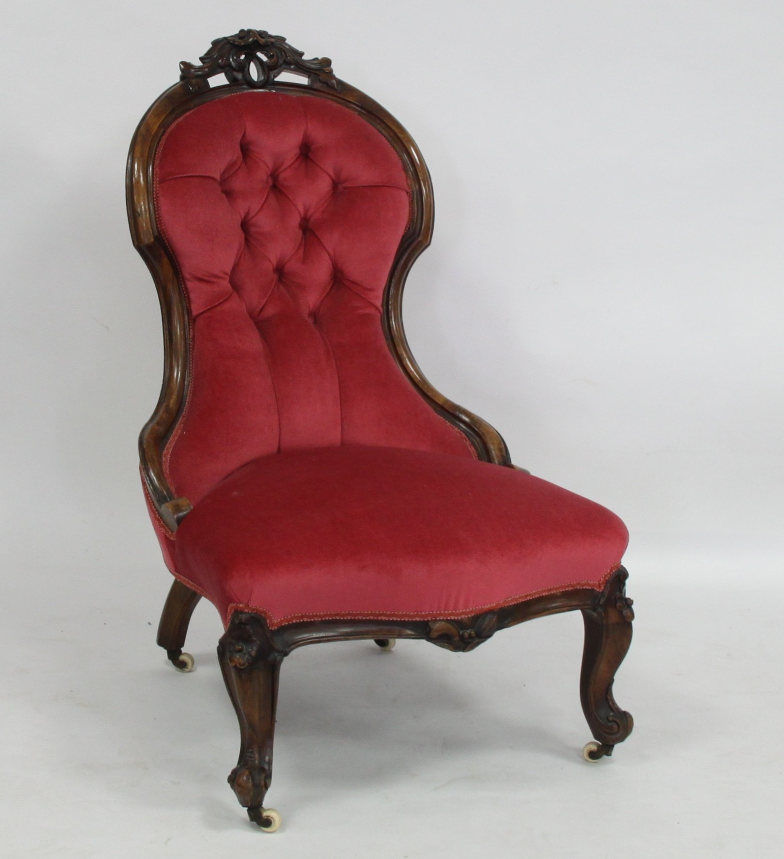 Appraisal: A Victorian carved beech framed chair the pierced carved crest